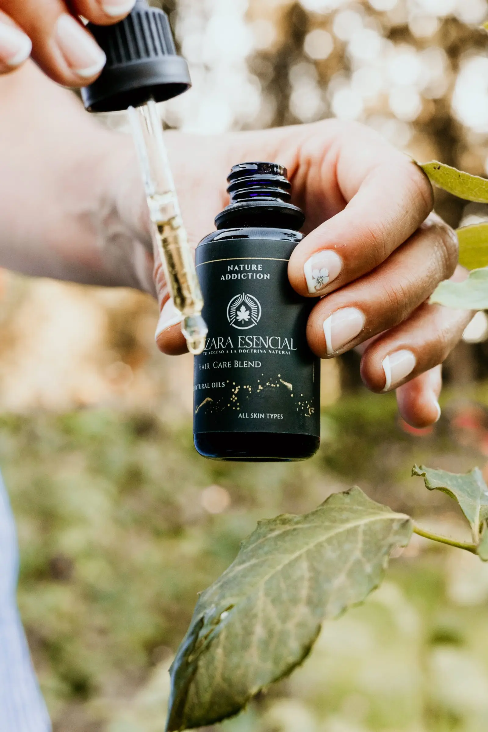 Hair care blends BY azara natural cinematic shot in the natural for the oil blend dropping