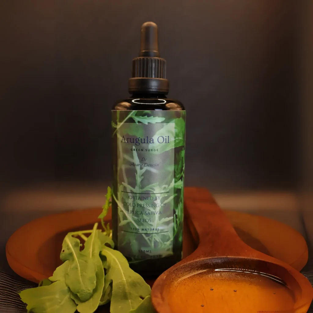 Product shot with black background for the bottle of arugula oil with a wooden spoon full of the oil BY azara natural