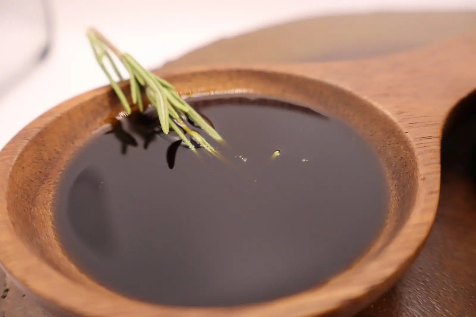 wooden cup-of-rosemary-oil-BY azara natural