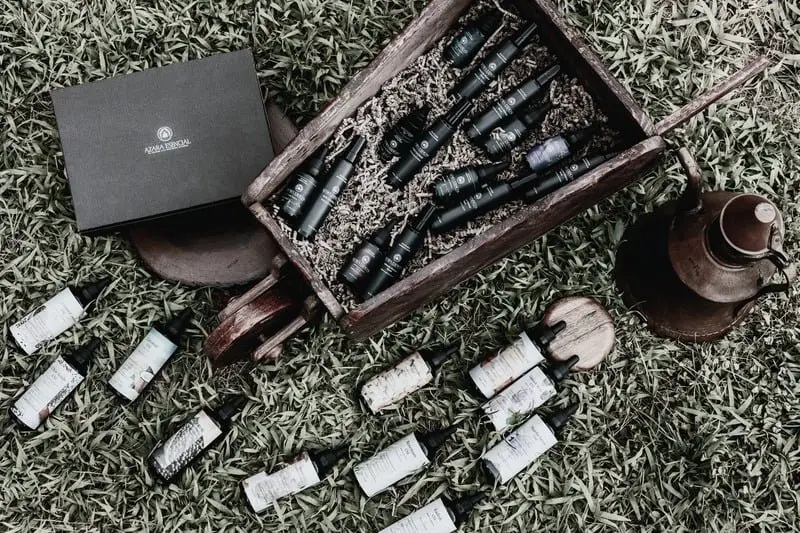 Holistic professional shot for azara products with some decorative vintage items with the closed box of azara natural in the nature the shot has been took for above